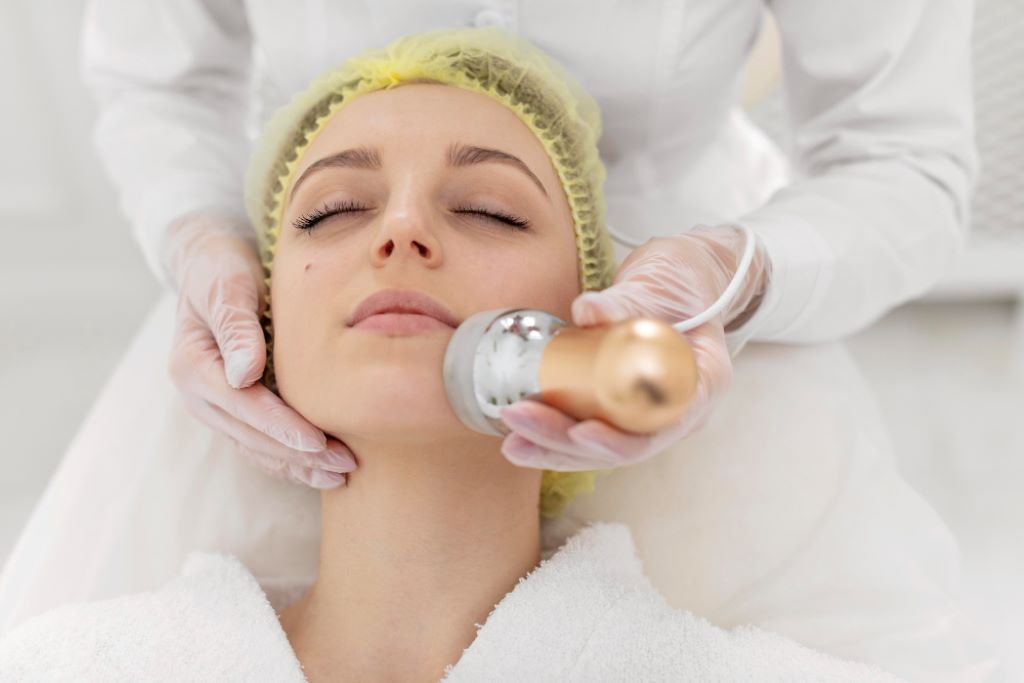 Woman receiving a facial skin treatment.