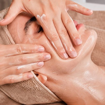 Spa facial massage with moisturizing cream