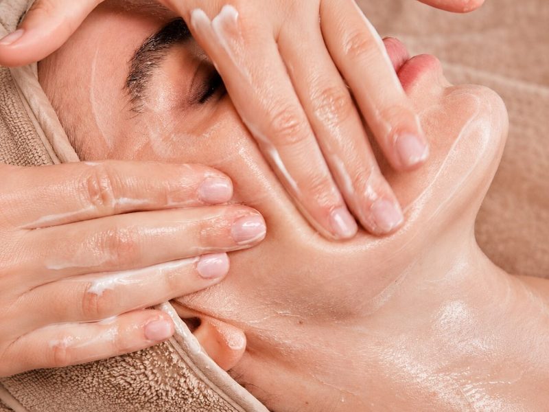 Spa facial massage with moisturizing cream