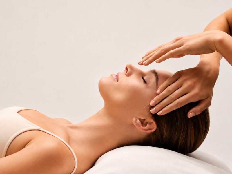 Woman receiving relaxing facial massage